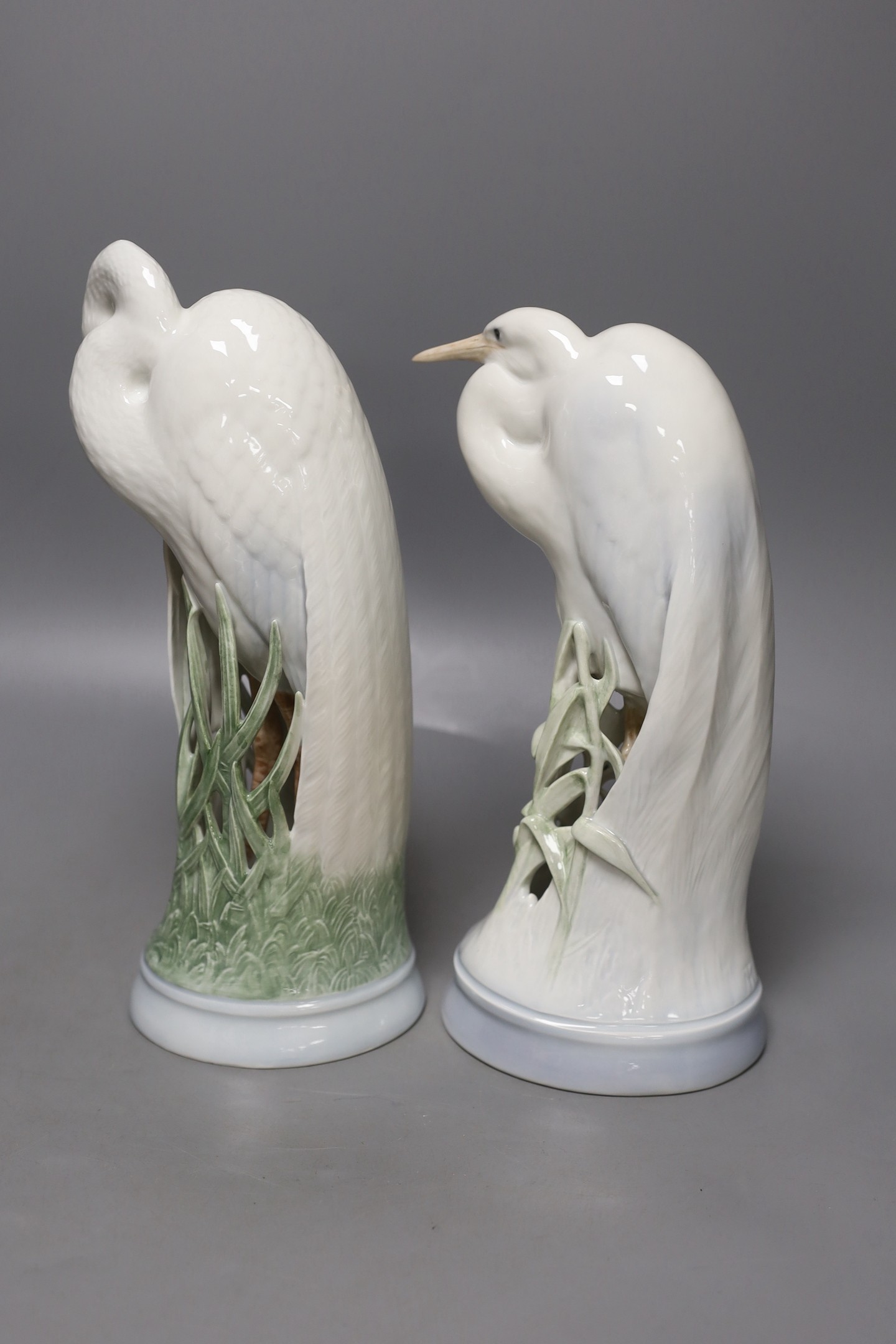 Two Royal Copenhagen figures of herons, model number 3002 and 532, 28 cms high.